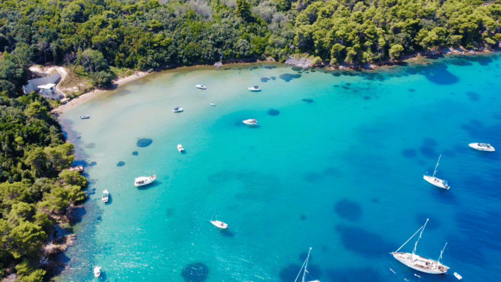 Crystal-clear Adriatic bay with boats near Croatia's Dalmatian Coast